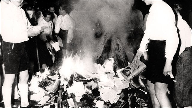 Members of the Nazi Hitler Youth on a book burning campaign in 1938